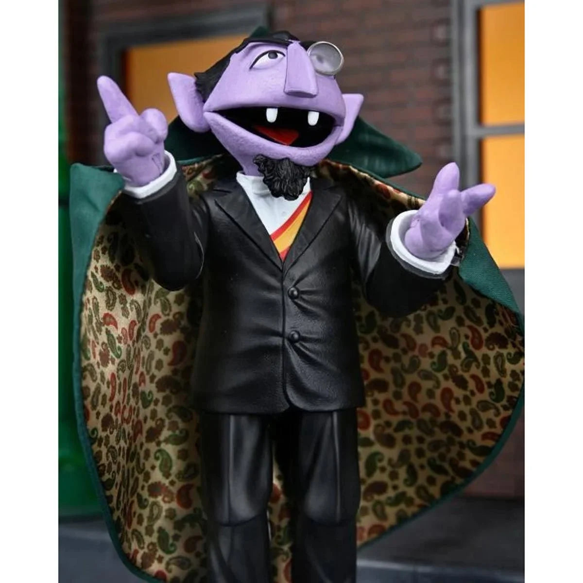 The Count - Sesame Street Ultimate NECA 7-Inch Scale Action Figure by Neca in black suit with green cape lining new in box
