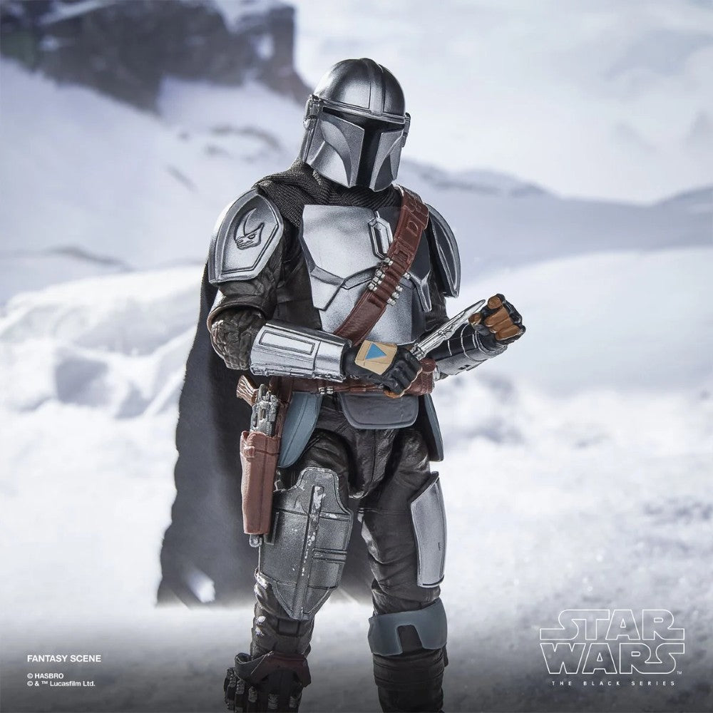 The Mandalorian & Grogu Deluxe Star Wars The Black Series 6-Inch Action Figure in armored suit holding a device in snowy scene new in box