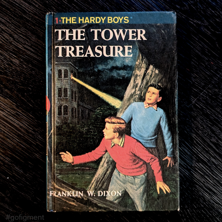 Vintage 1959 Hardy Boys book The Tower Treasure with blue bar and red number one on cover by Grosset & Dunlap