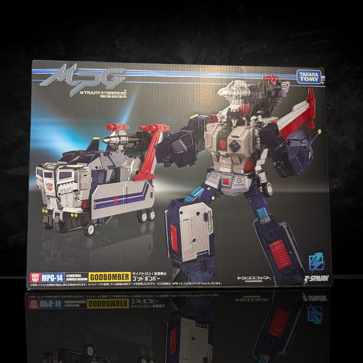 Hasbro Collectibles - Transformers - Takara Tomy - MPG-14 Godbomber Converting Action Figure in robot and vehicle mode on box art