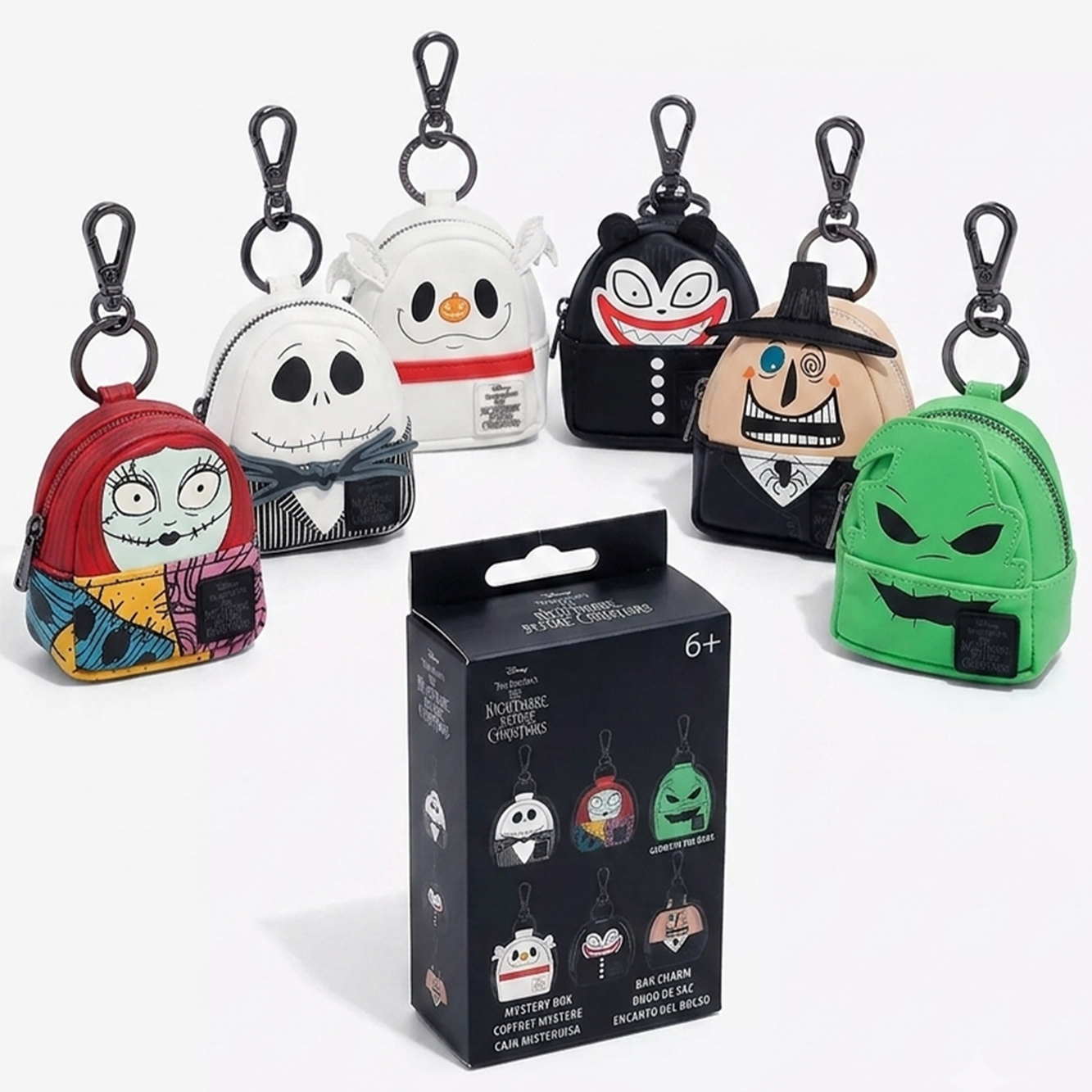 The Nightmare Before Christmas U-PICK Loungefly Mini-Backpack Mystery Box Bag Charm Key Chain set by Loungefly displayed.