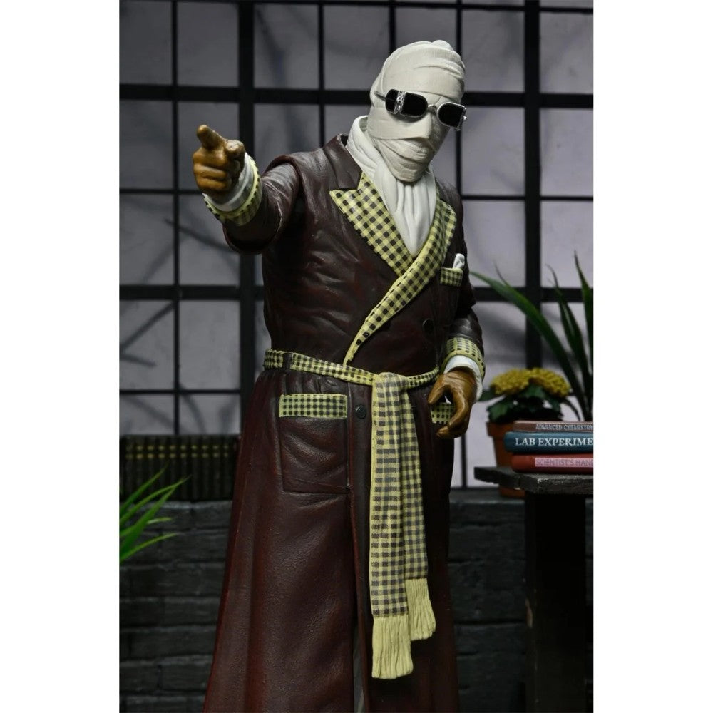 The Invisible Man Kemp House Color Universal Monsters Ultimate Action Figure NECA 7” standing in brown robe with scarf, new in box collectible