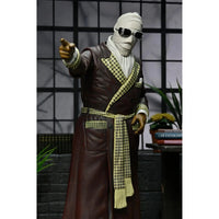 The Invisible Man Kemp House Color Universal Monsters Ultimate Action Figure NECA 7” standing in brown robe with scarf, new in box collectible