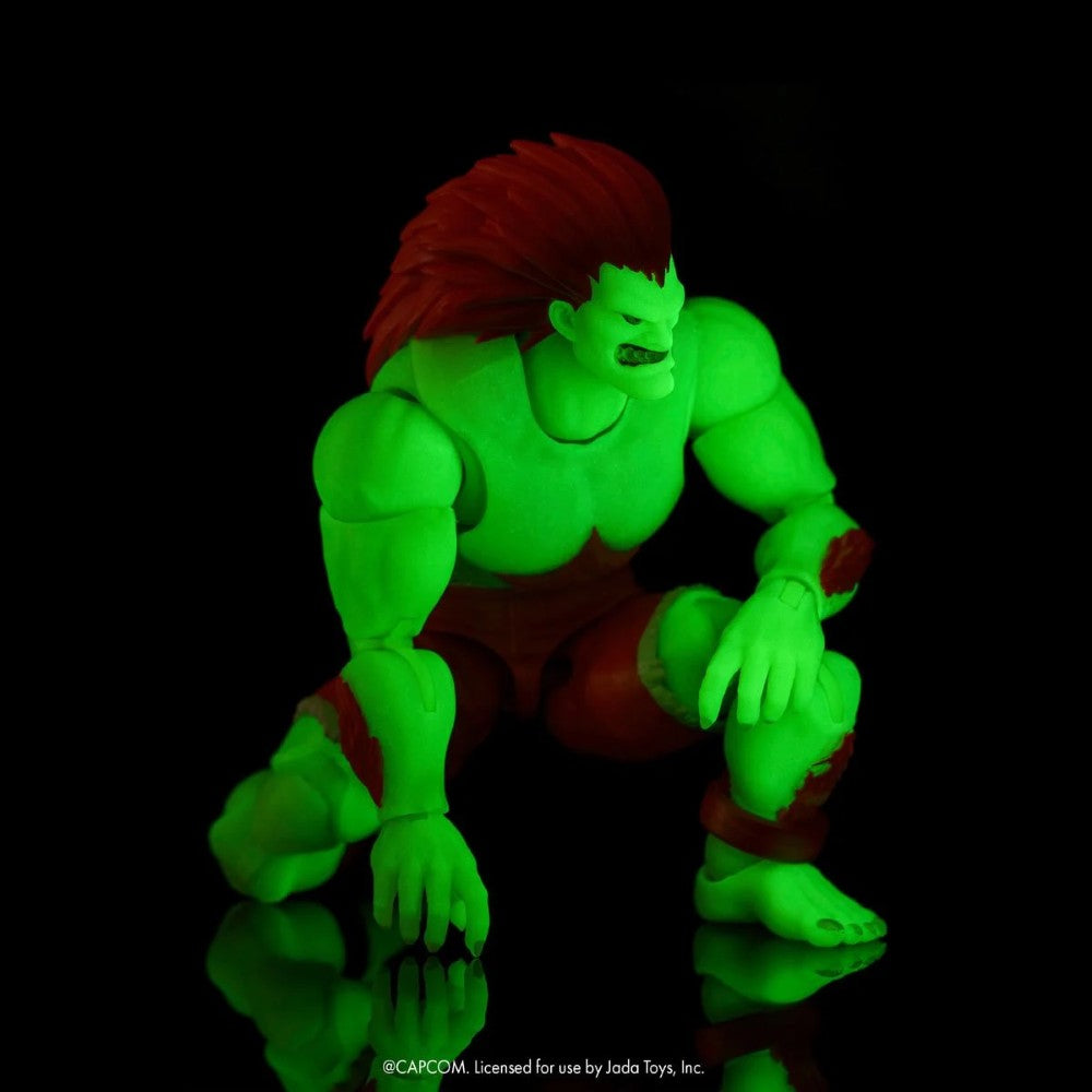 Blanka Ultra Street Fighter II Glow-in-the-Dark 6-Inch Action Figure Jada Toys in crouched pose glowing green