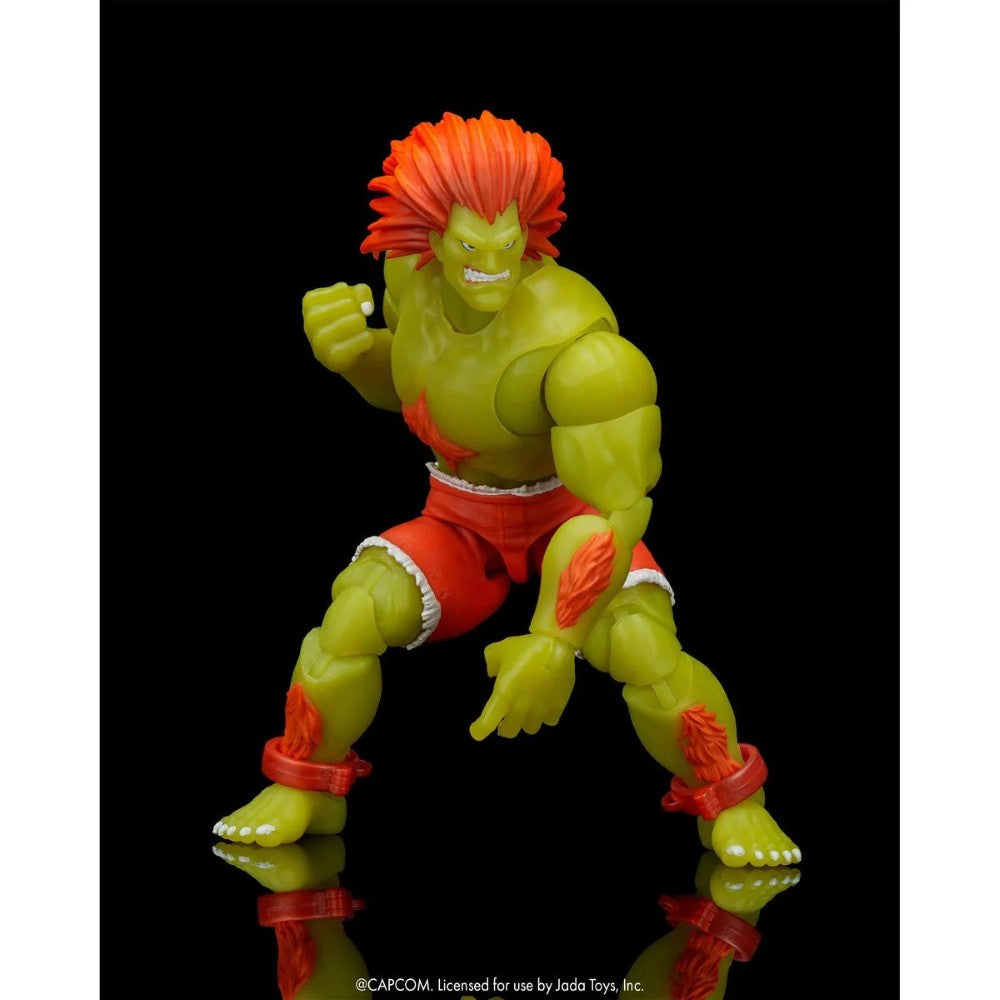 Blanka Ultra Street Fighter II Glow-in-the-Dark 6-Inch Action Figure Jada Toys in dynamic battle pose with green skin and orange hair