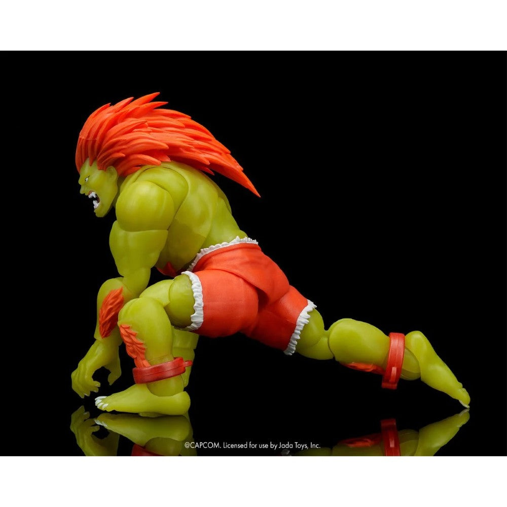 Blanka Ultra Street Fighter II Glow-in-the-Dark 6-Inch Action Figure Jada Toys crouching pose with bright orange hair and red shorts.