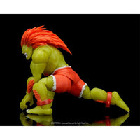 Blanka Ultra Street Fighter II Glow-in-the-Dark 6-Inch Action Figure Jada Toys crouching pose with bright orange hair and red shorts.