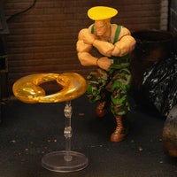 Jada Toys Ultra Street Fighter II Colonel Guile 6-inch action figure with yellow hair and energy effect accessory