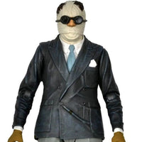 The Invisible Man Universal Monsters Ultimate Action Figure NECA 7” in black suit, blue tie, bandaged head, and goggles collectible toy