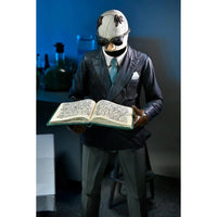 The Invisible Man Universal Monsters Ultimate Action Figure NECA 7” in suit and gloves holding open book collectible toy