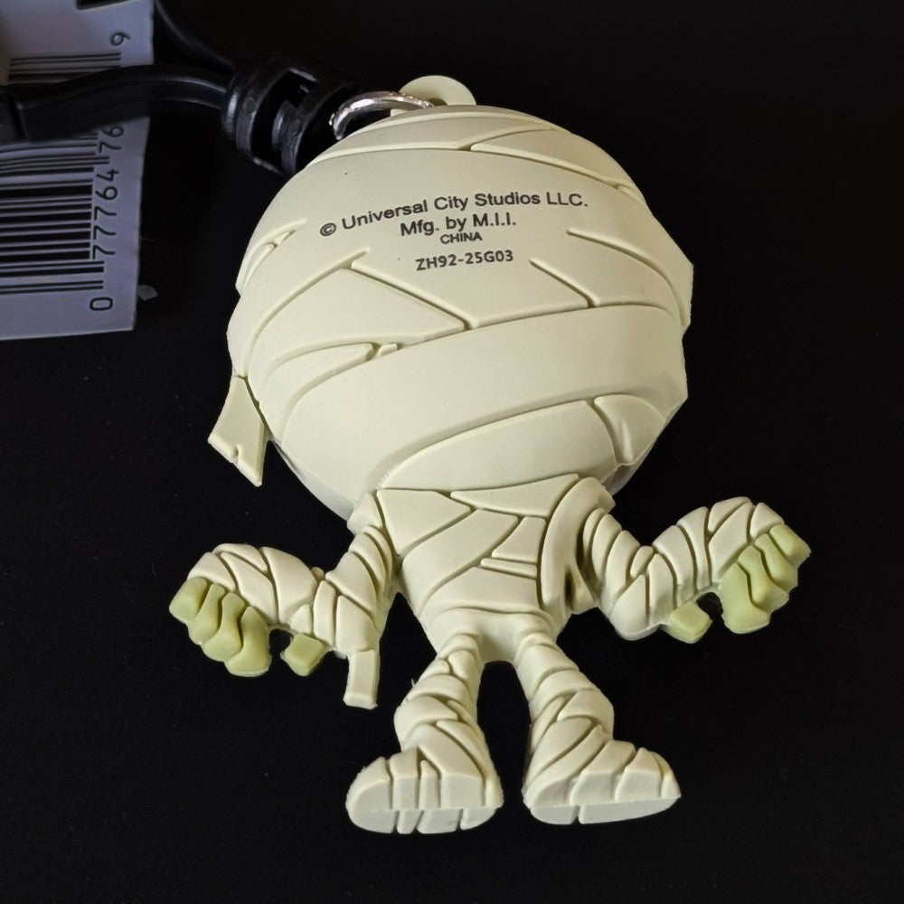 Go Figment Universal Monsters Series 4 figural bag clip showing back view of wrapped mummy character with keyring attachment