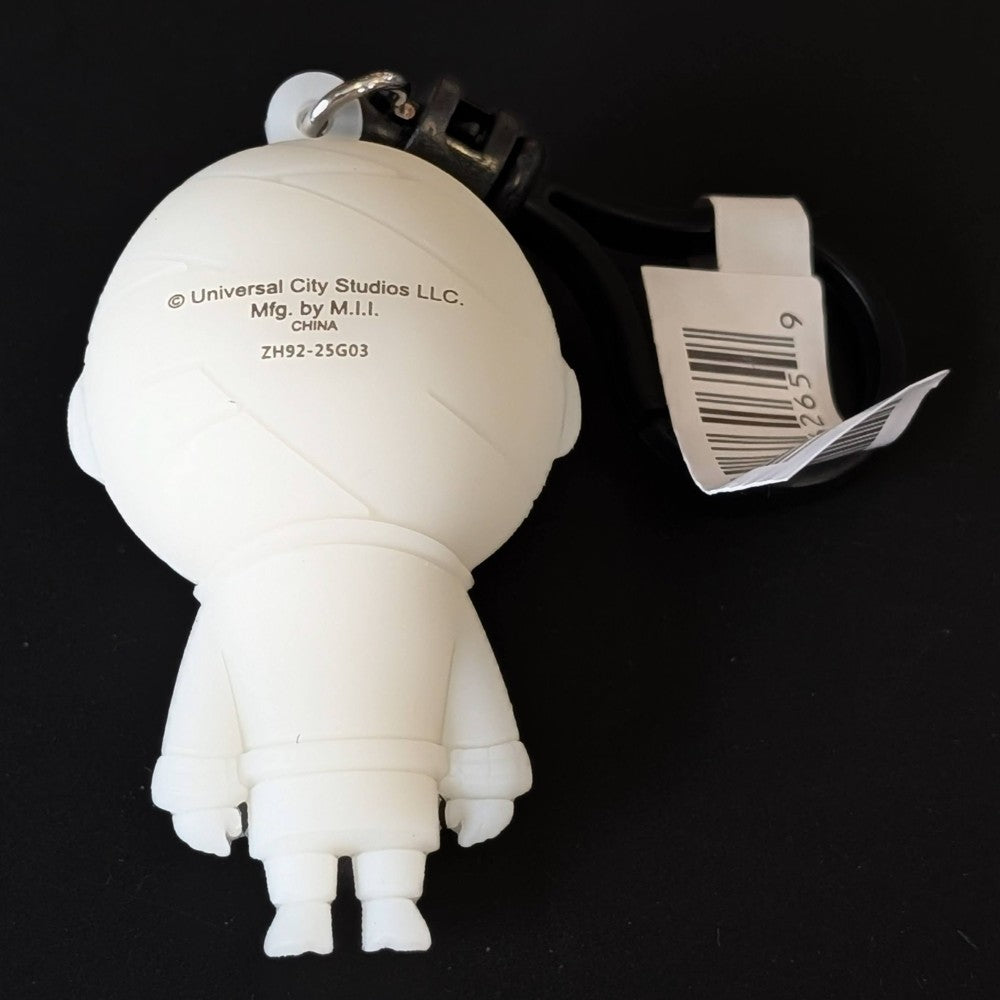 Go Figment Universal Monsters Series 4 white mummy figure bag clip showing back with keyring and barcode tag on black background