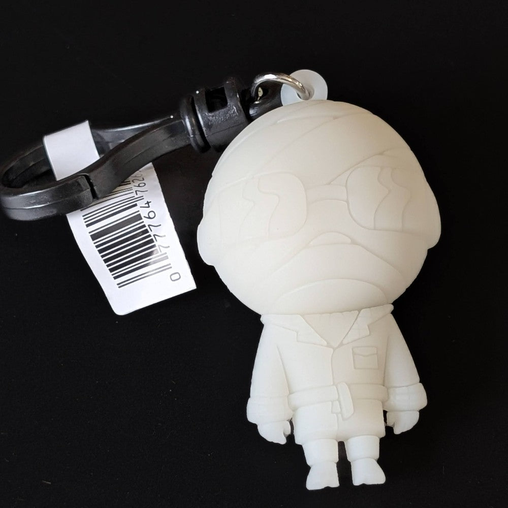 Go Figment Universal Monsters Series 4 white mummy character bag clip with black keyring and barcode tag on dark background