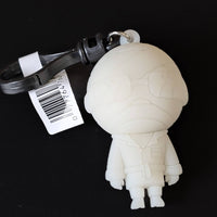 Go Figment Universal Monsters Series 4 white mummy character bag clip with black keyring and barcode tag on dark background