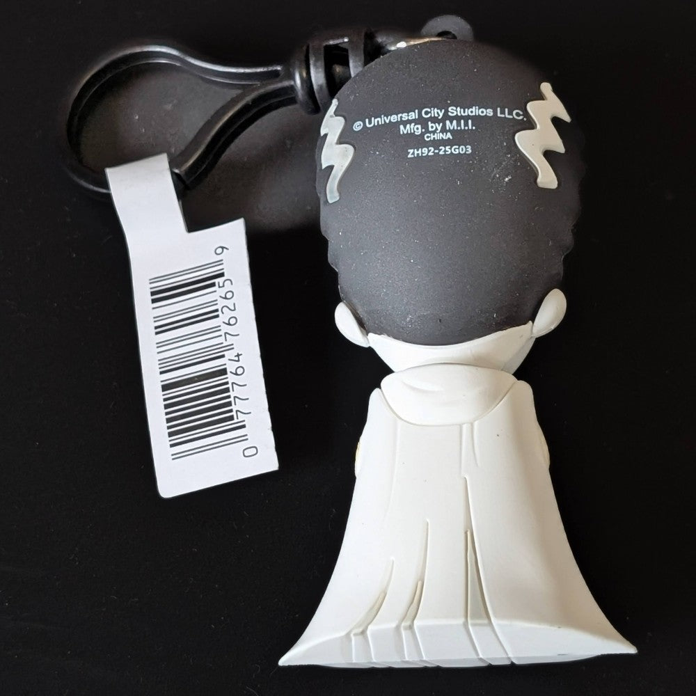 Go Figment Universal Monsters Series 4 figural bag clip showing back of character with white cape and attached barcode tag