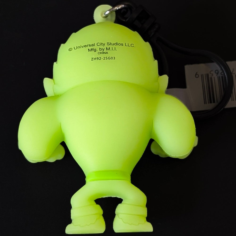 Go Figment Universal Monsters Series 4 bright green 3D foam bag clip showing back with attached black keyring and barcode tag