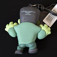 Go Figment Universal Monsters Series 4 green Frankenstein bag clip showing back with attached keyring and barcode tag