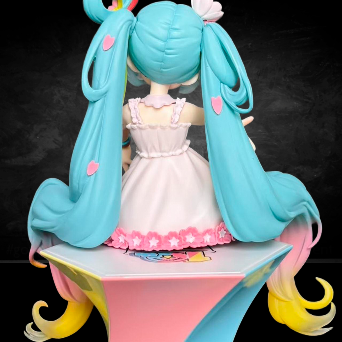 Hatsune Miku 10th Anniversary Noodle Stopper Statue FuRyu by Banpresto showing figure from back with pastel dress and blue pigtails