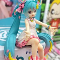 Hatsune Miku 10th Anniversary Noodle Stopper Statue FuRyu by Banpresto in white dress with pink floral and rainbow accessories