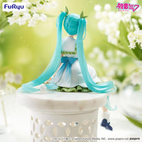 Hatsune Miku Flower Fairy Lily of the Valley Noodle Stopper Figure FuRyu by Banpresto with long turquoise twin tails seated on white pedestal