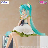 Hatsune Miku Flower Fairy Lily of the Valley Noodle Stopper Figure FuRyu by Banpresto seated with green and white dress