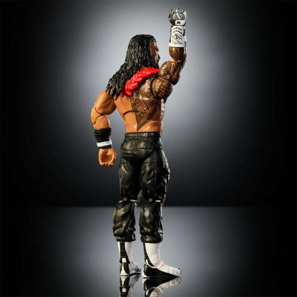 Back view of a muscular long-haired warrior figure with tattoos, a red shoulder strap, black pants, and boots