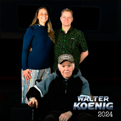 Three people posing with one seated wearing a cap and two standing behind against black background with Walter Koenig 2024 text
