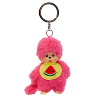 Pink furry monkey keychain wearing a yellow bib with a watermelon design