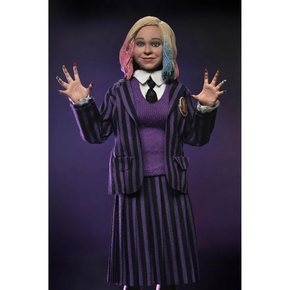 Clothed action figure of a girl with half pink, half blue hair in a purple striped school uniform on dark background