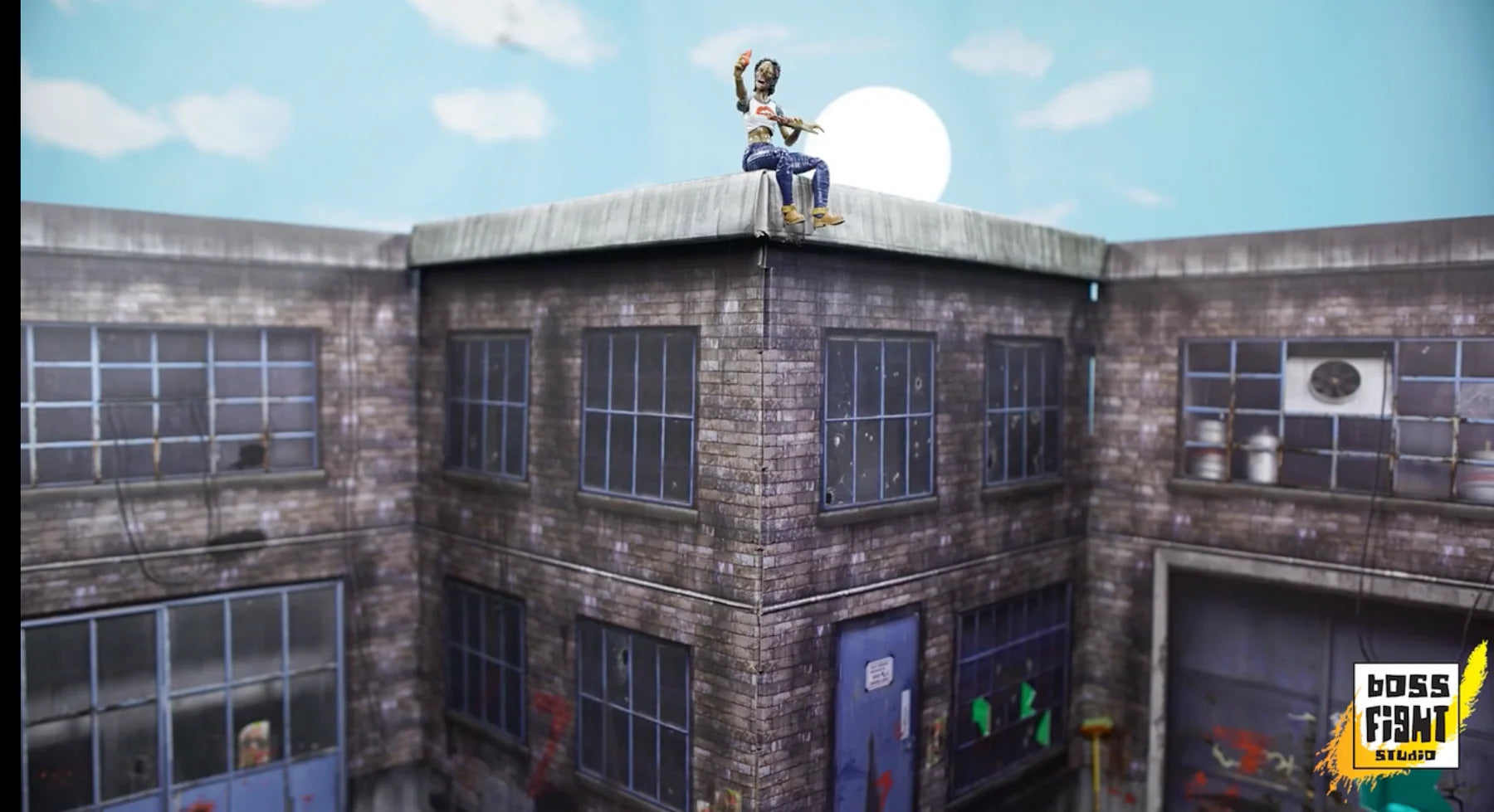 Person sitting on a rooftop with a blue sky background