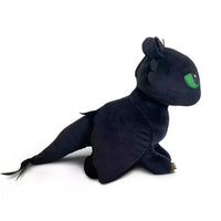 Spin Master How to Train Your Dragon Toothless plush with soft fabric and light-up green eyes, 17 inches long.