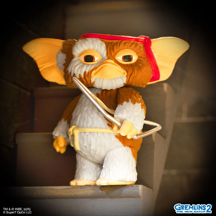 Super7 Gizmo Battle Ready GreAction Figure holding bow in detailed brown and white fur with red headband close-up view