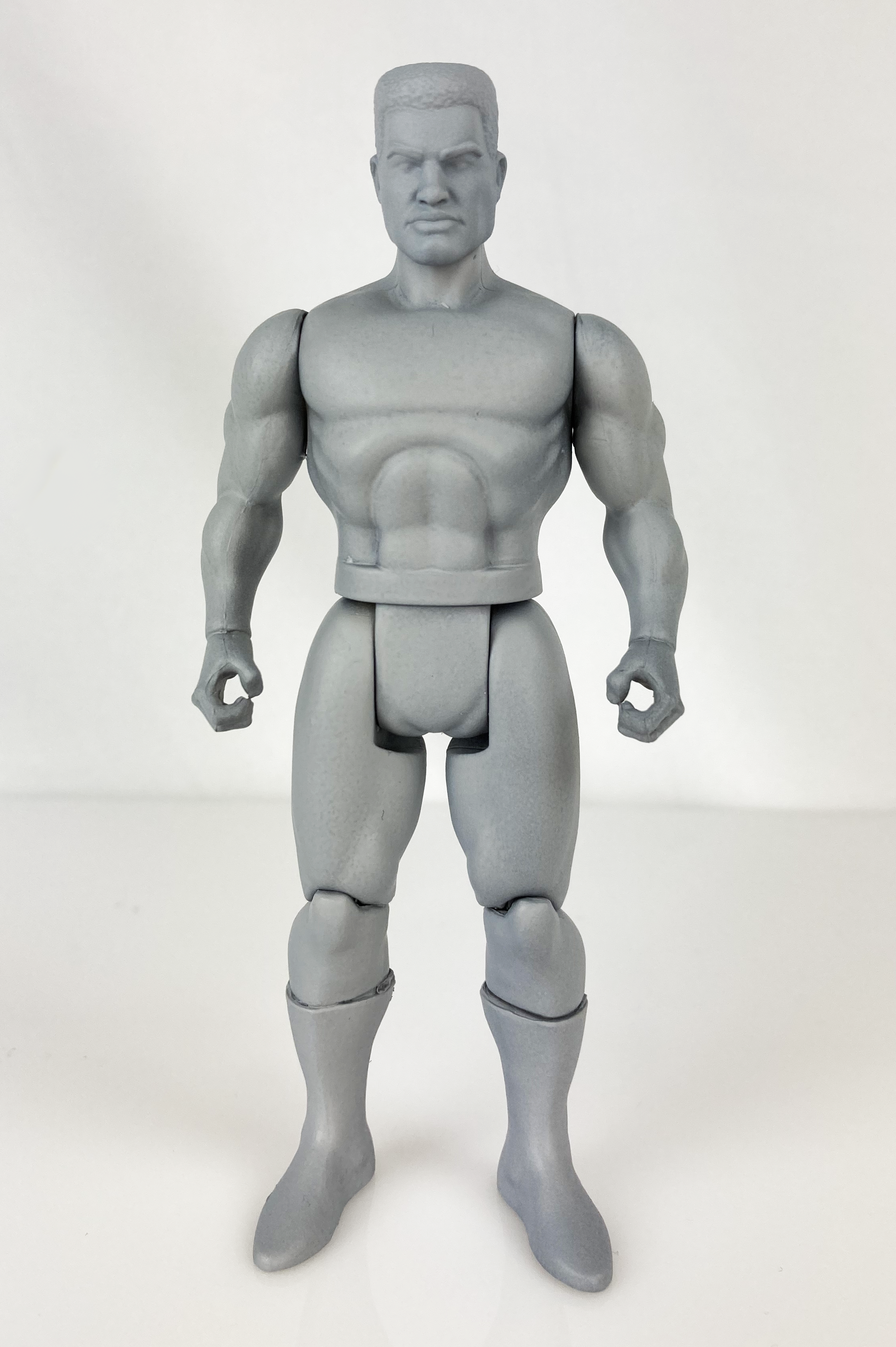 Boss Fight Studio Llc 5-inch gray blank muscular action figure with articulated joints on white background