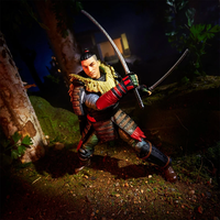 Hasbro GI Joe Classified Series 1:12 Kyle Budo action figure posed with dual swords in forest setting at night