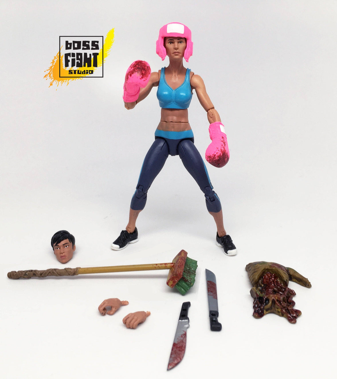 Action figure with accessories on a white background, featuring 'Boss Fight Studio' logo.