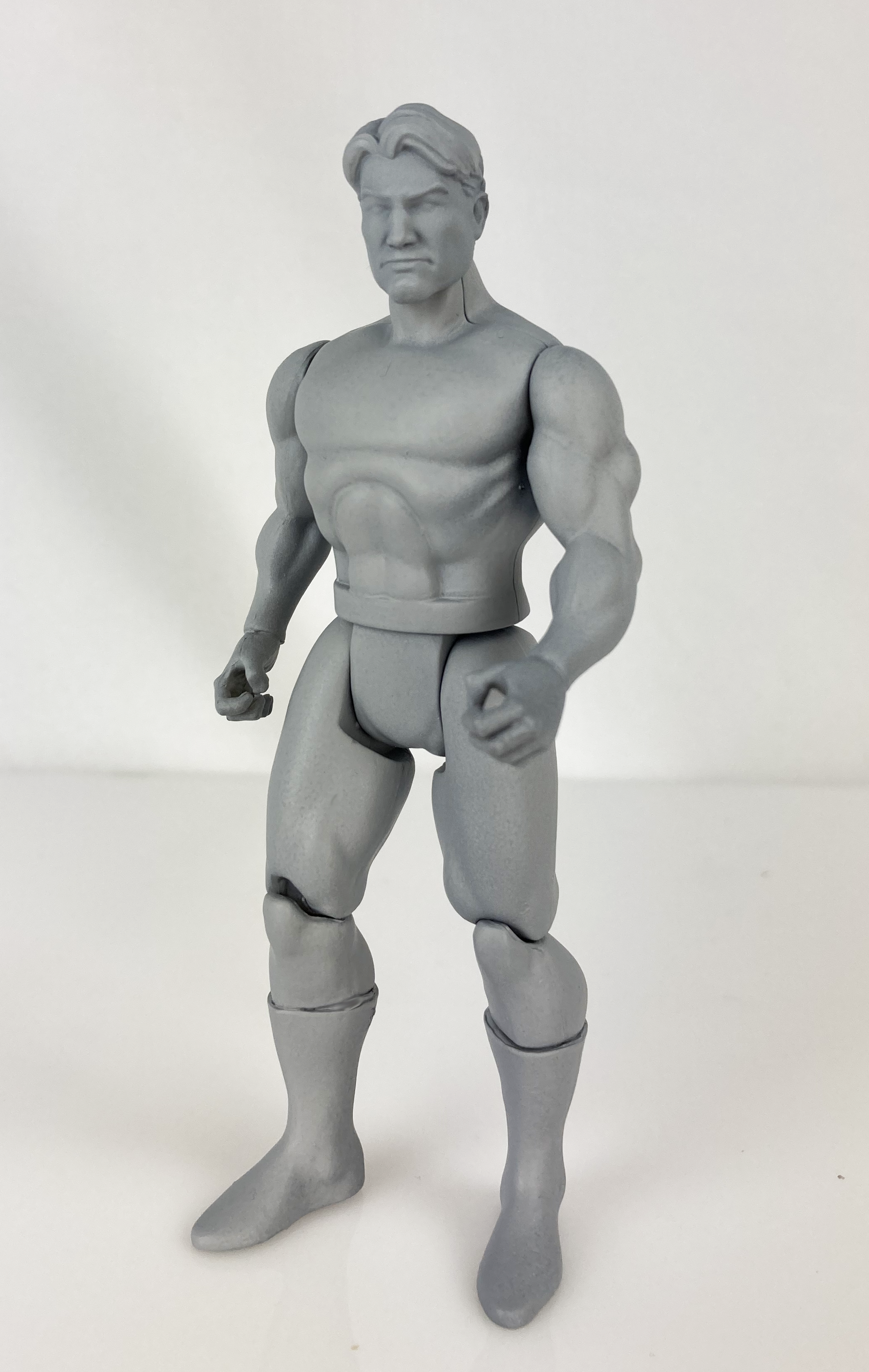 Boss Fight Studio Llc 5-inch gray blank retro-style action figure with muscular build and articulated joints on white background