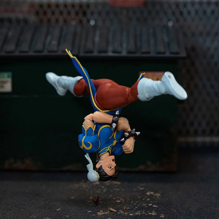 Jada Toys Ultra Street Fighter II Chun-Li 6-inch action figure performing a dynamic upside-down kick pose outdoors