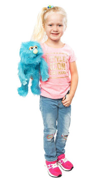 Silly Puppets - Silly Puppets Monster, Blue (14") plush with movable arms and nose held by child in pink shirt and jeans