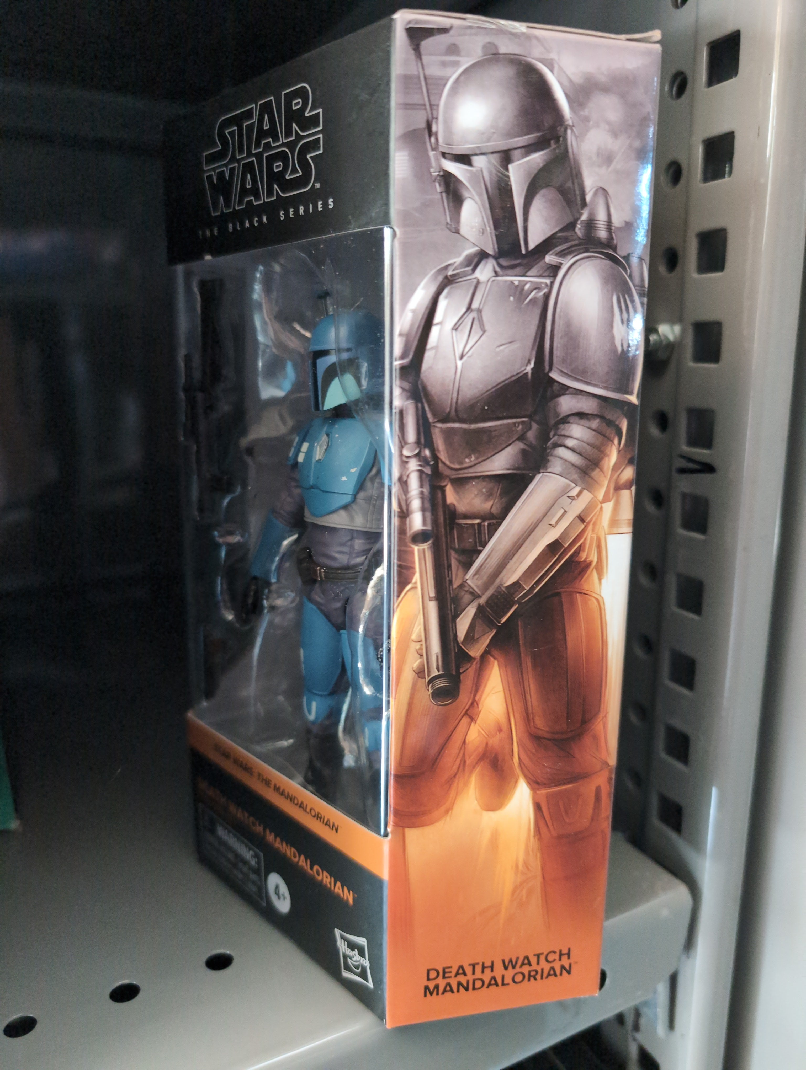 Hasbro Star Wars Black Series Death Watch Mandalorian action figure in collector box on shelf