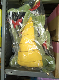 Silly Puppet Green Dragon Puppet with Movable Mouth by Silly Puppets, wrapped in plastic on storage shelf