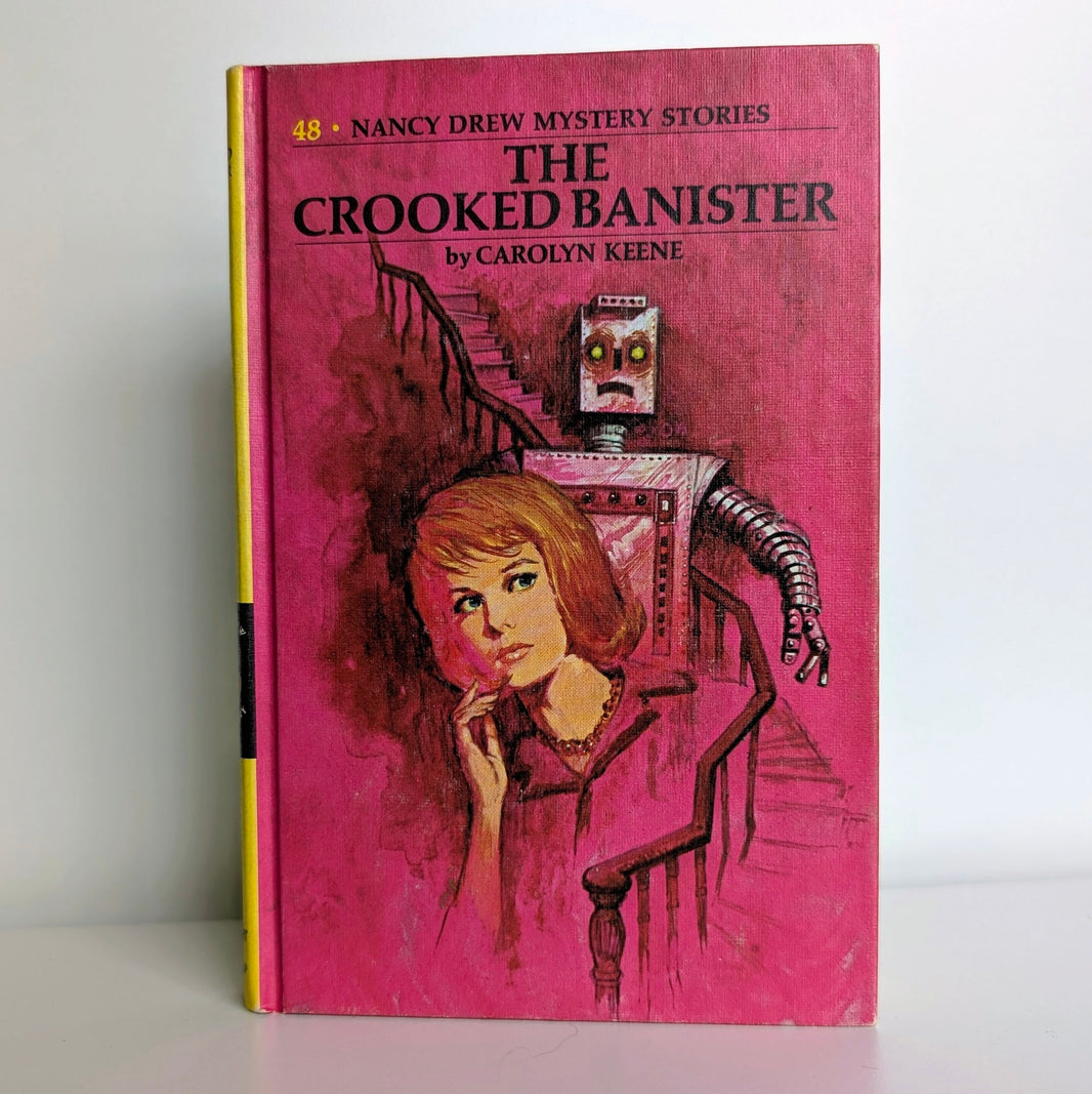 Vintage Grosset & Dunlap Nancy Drew Mystery Stories The Crooked Banister hardcover book with pink cover artwork