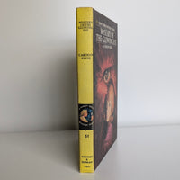 Vintage Nancy Drew 51 Mystery of the Glowing Eye hardcover book by Grosset & Dunlap 1974 angled view