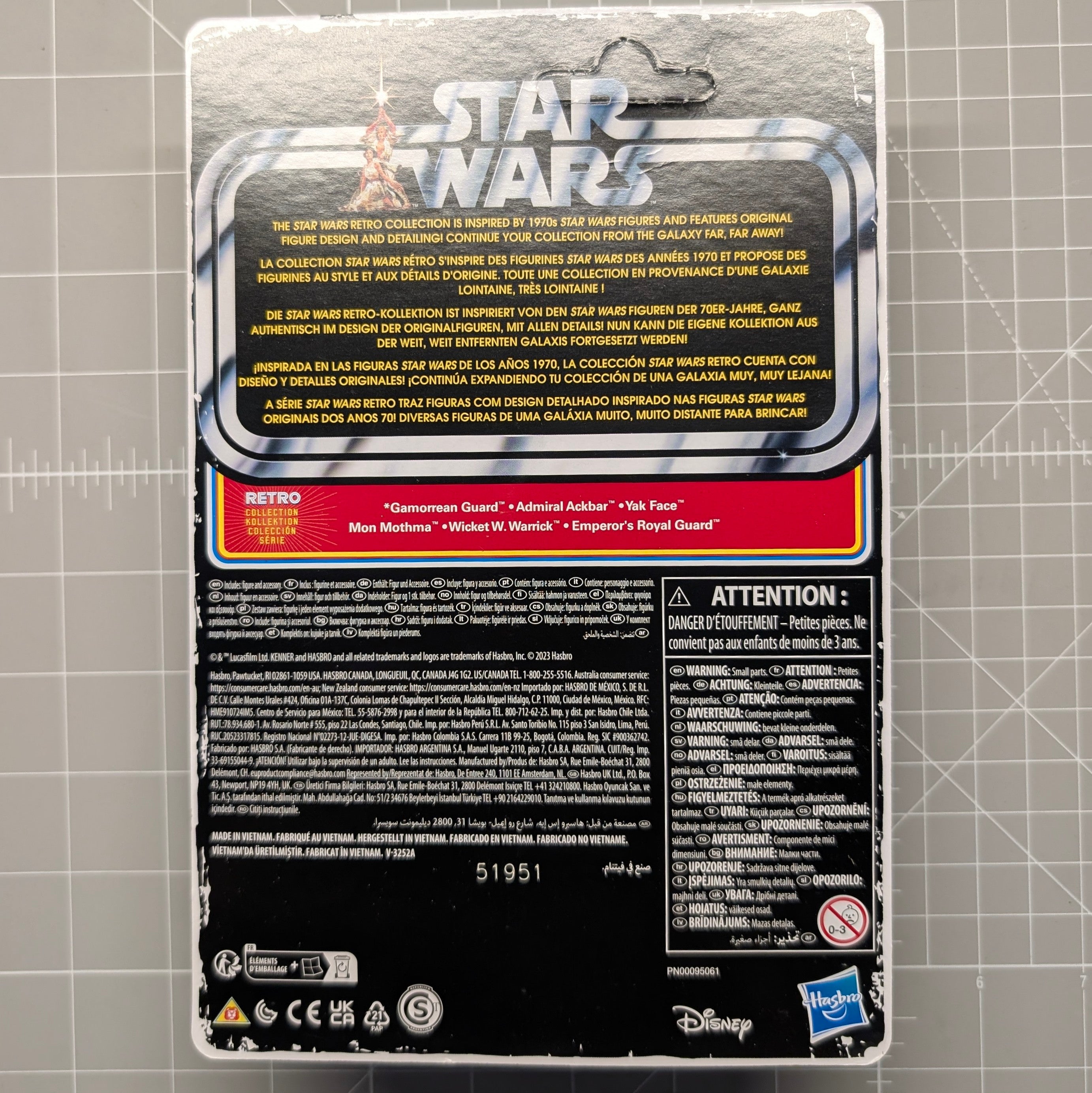 Back of Star Wars Retro Collection packaging with character names, safety information, Disney and Hasbro logos