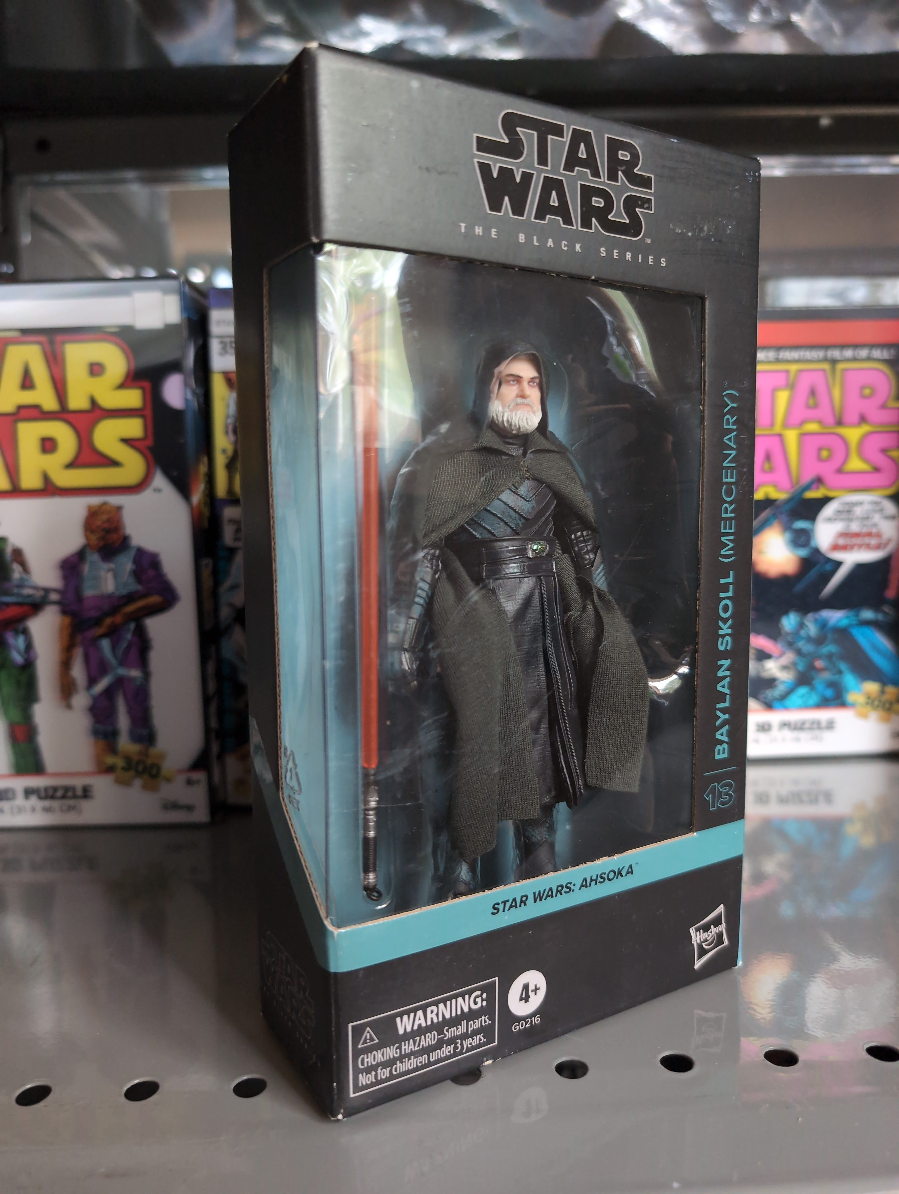 Hasbro Star Wars Black Series Baylan Skoll action figure with orange lightsaber in collector packaging