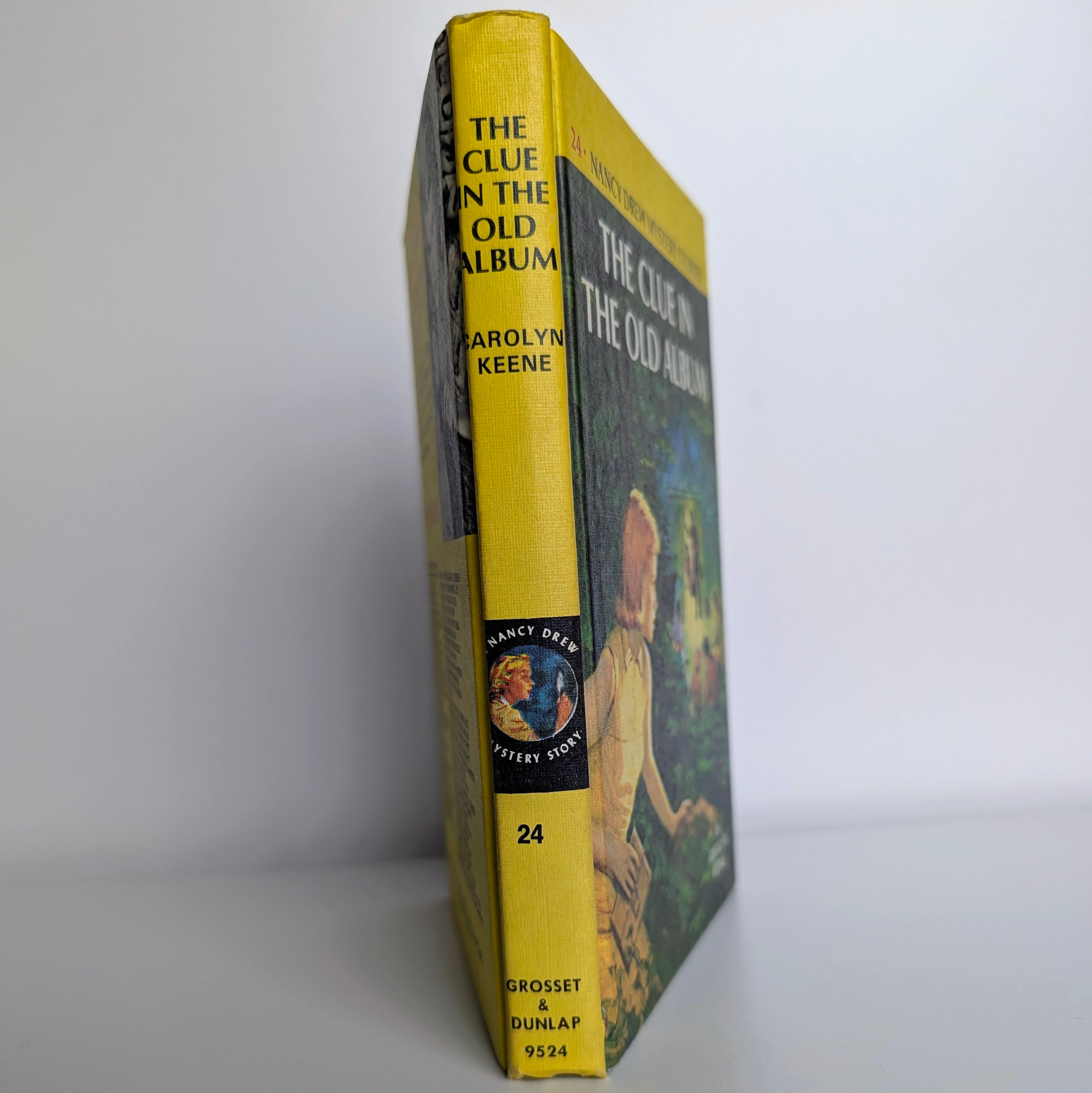Vintage Grosset & Dunlap Nancy Drew Mystery #24 The Clue in the Old Album yellow bar edition book spine view