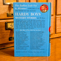 Vintage 1970 Hardy Boys book 23 The Melted Coins published by Grosset & Dunlap Inc with blue back cover