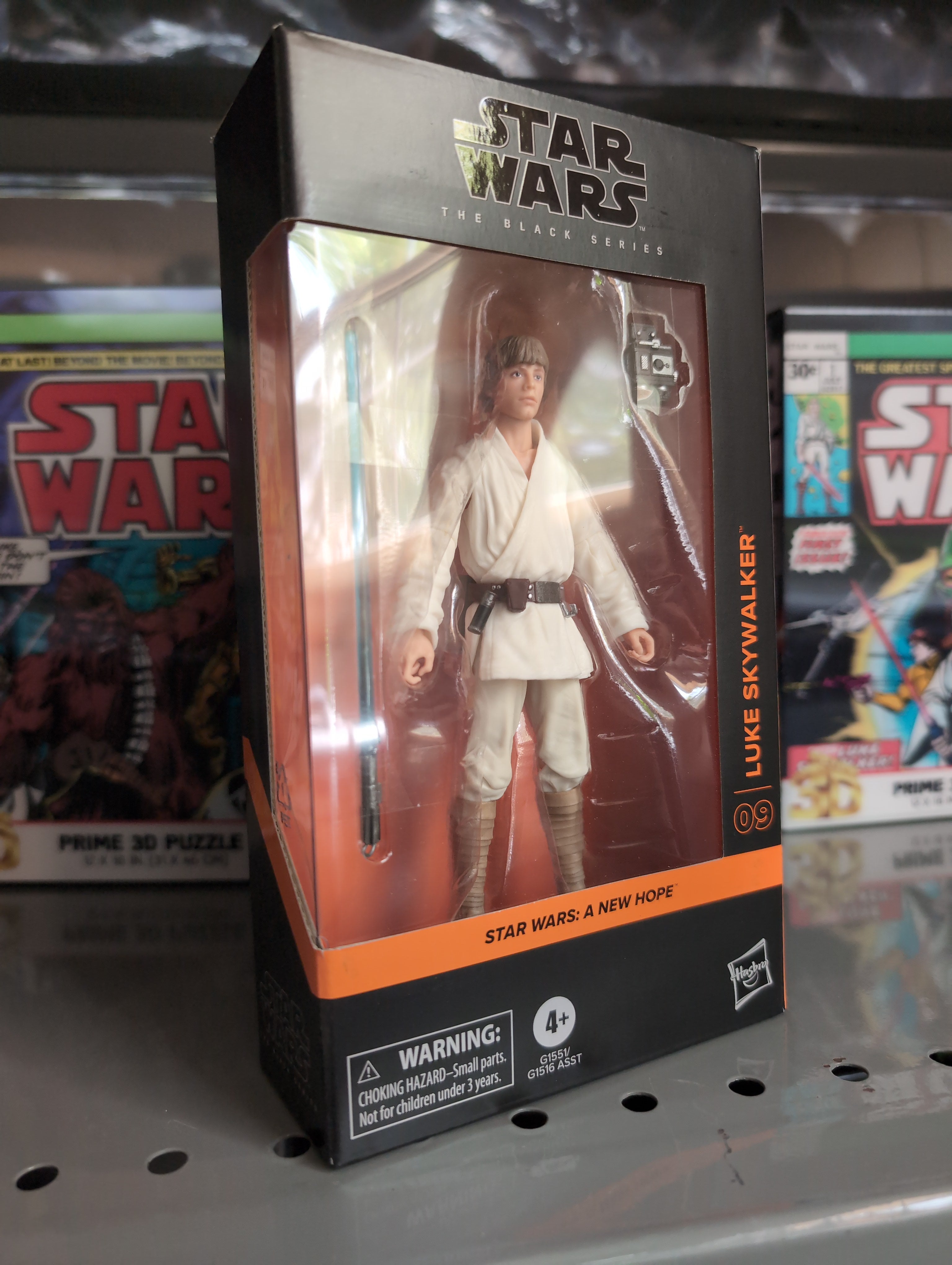 Hasbro Star Wars Black Series Luke Skywalker action figure in Tatooine outfit with blue lightsaber in display box