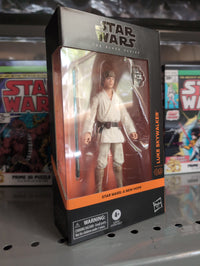 Hasbro Star Wars Black Series Luke Skywalker action figure in Tatooine outfit with blue lightsaber in display box