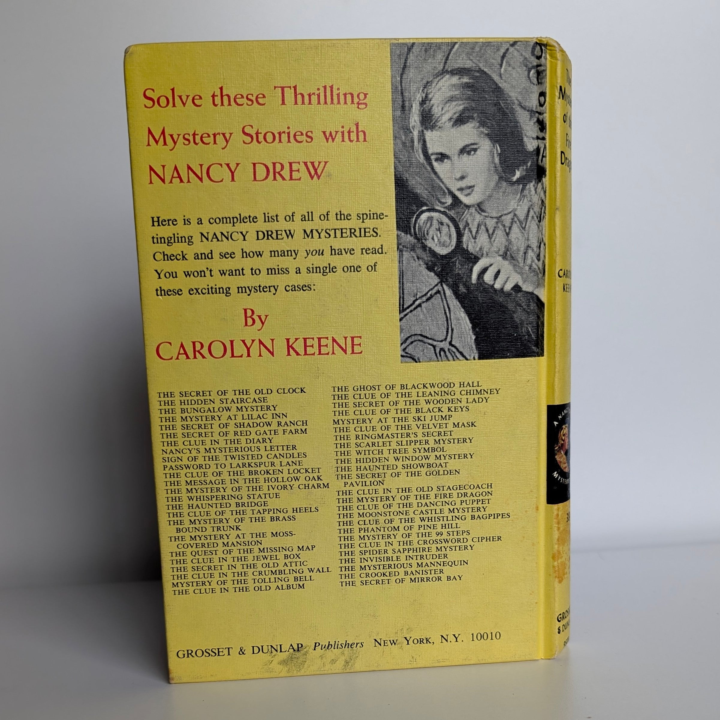 Vintage Nancy Drew The Mystery of the Fire Dragon book by Grosset & Dunlap Inc with white endpages and yellow cover
