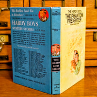 Vintage Hardy Boys book The Phantom Freighter 26 by Grosset & Dunlap Inc with classic blue back cover design
